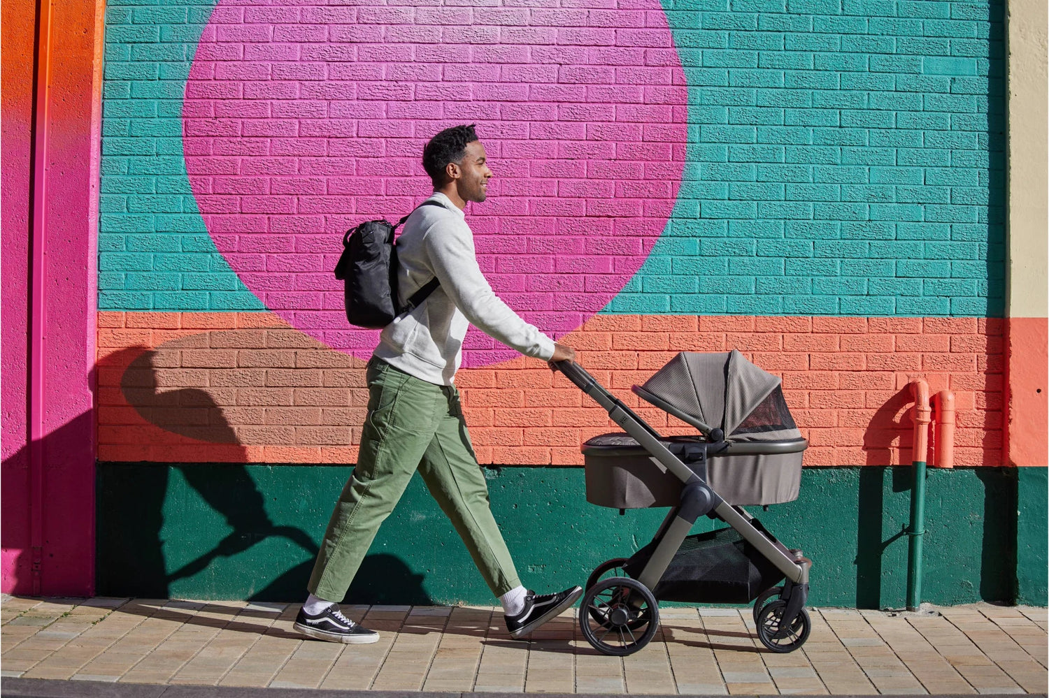 man walking with pushchair