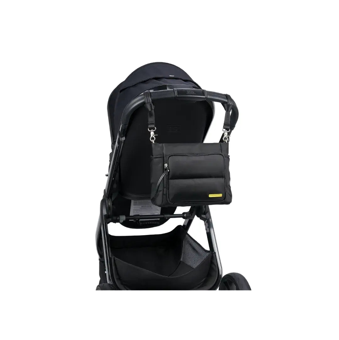 joey baby changing bag on the back of the raffi travel system
