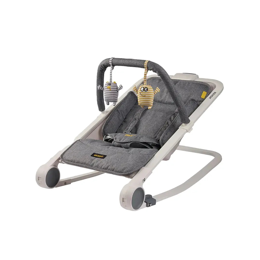 Gray baby bouncer with toys on a white background