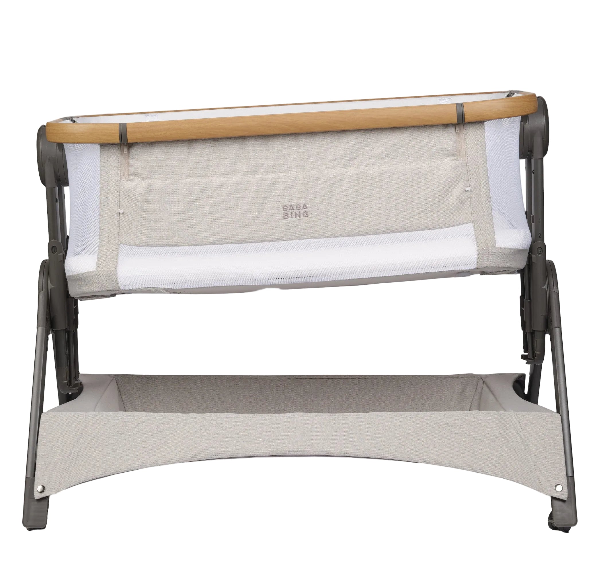 Portable crib with beige and brown design on a white background