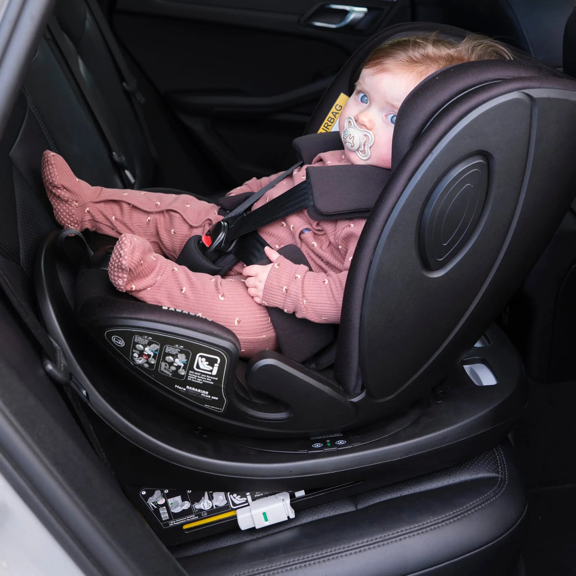 lifestyle image of baby in car seat