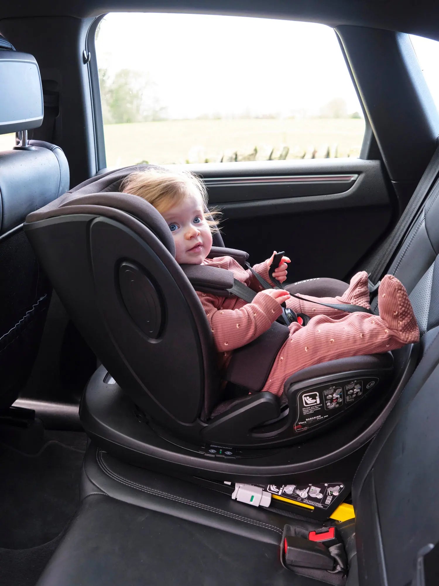 lifestyle image of baby in car seat